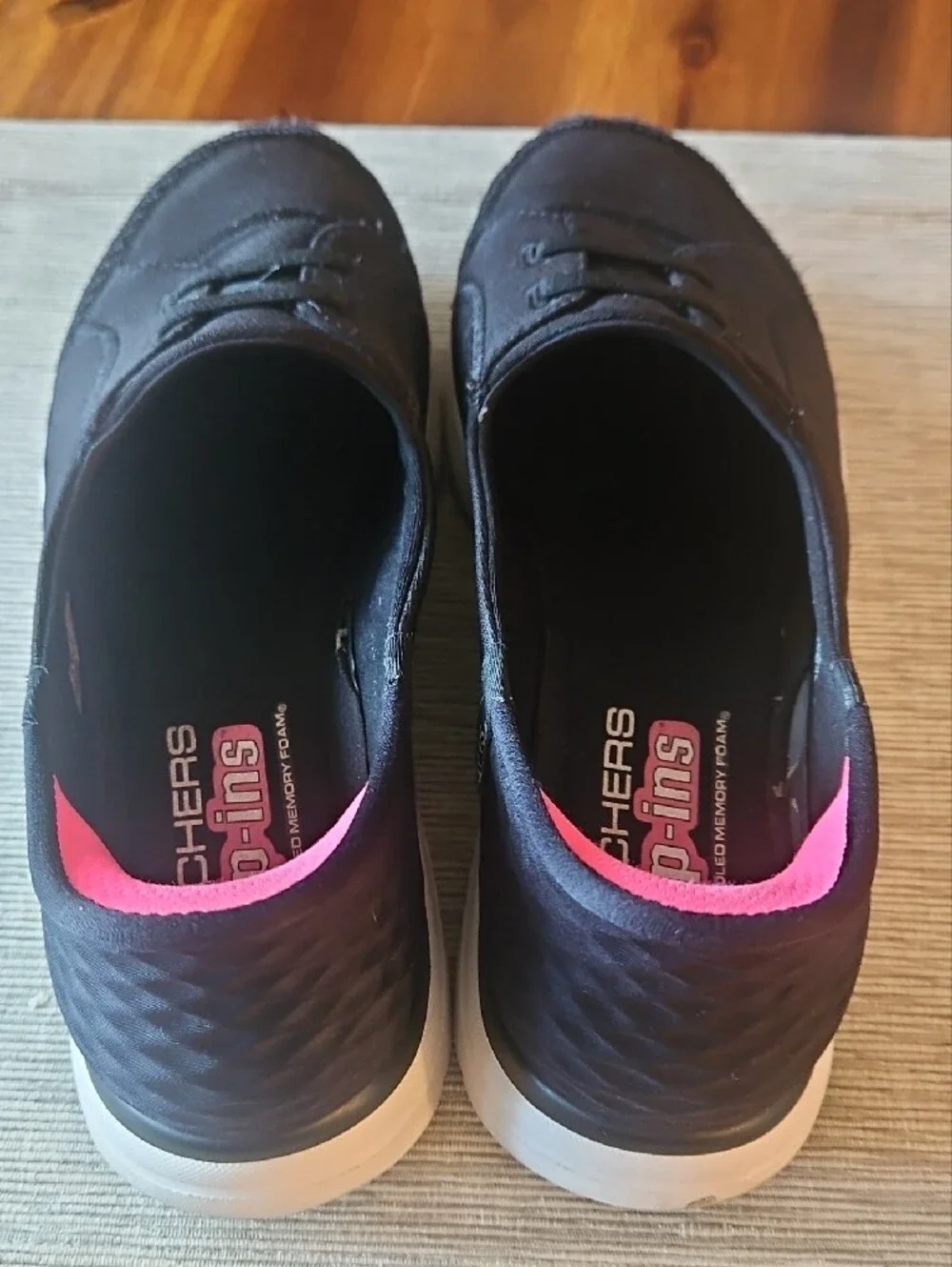 Skechers Women's Black Slip-On Sneakers with Pink Lining